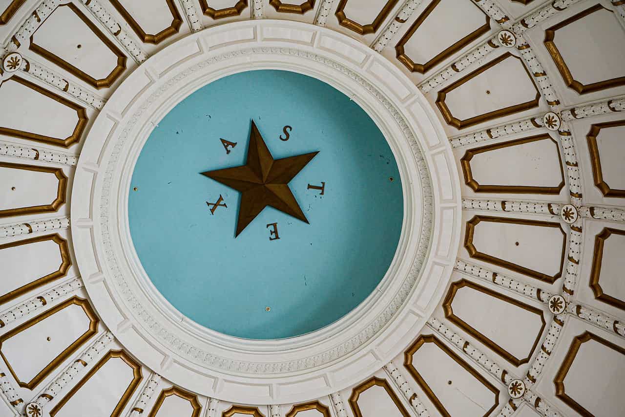 The inside of a state capitol dome, a gold star at its centre