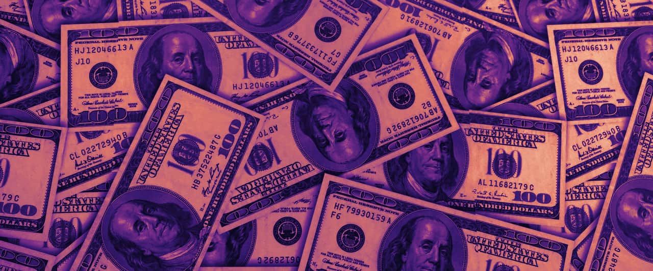 A spread of one hundred US dollar banknotes