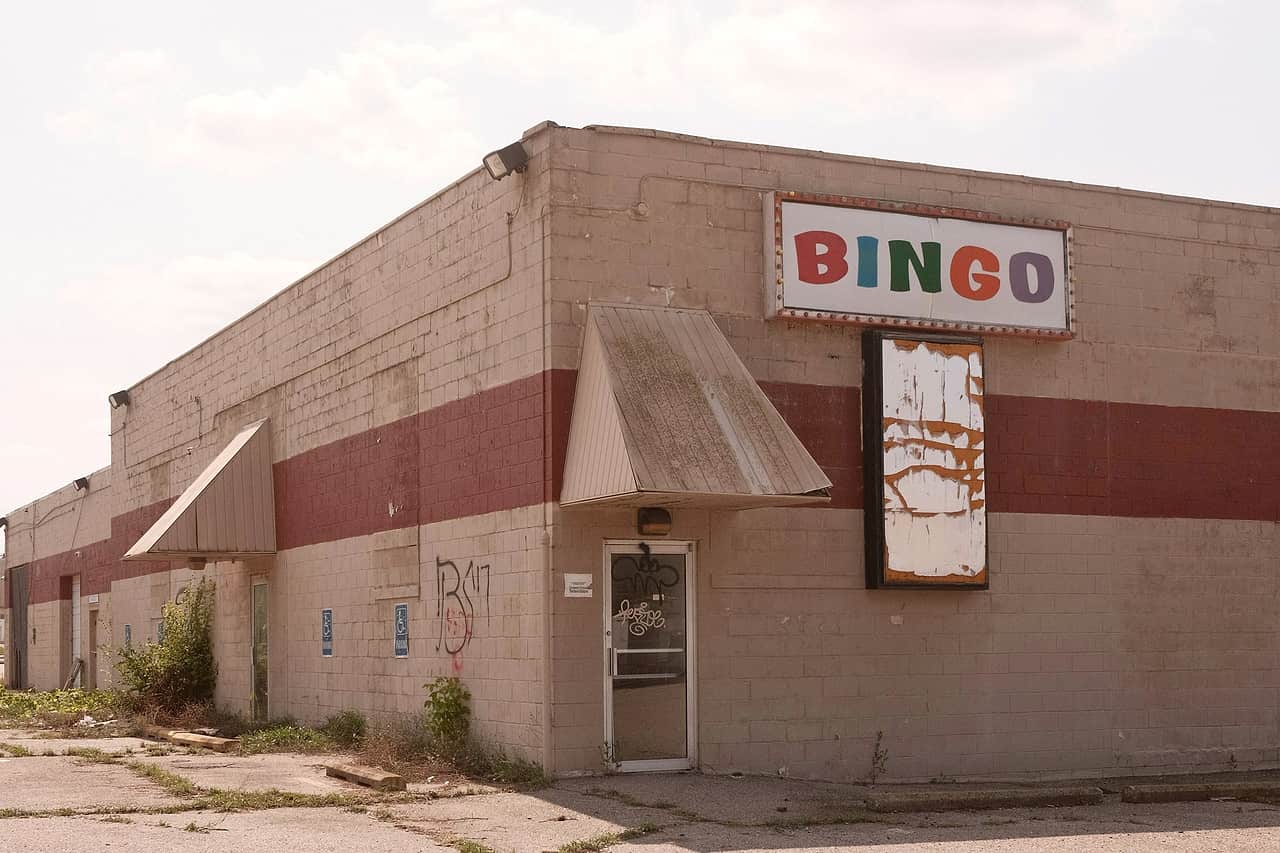 A low brick building with a Bingo sign above its door in Flint