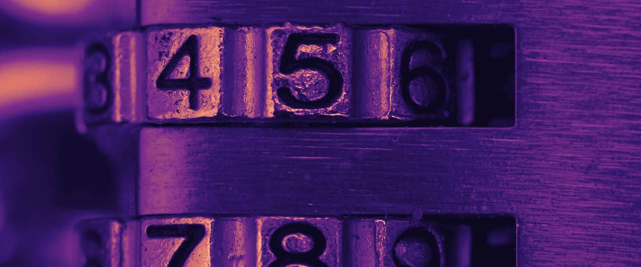 The number wheels of a combination lock in close-up