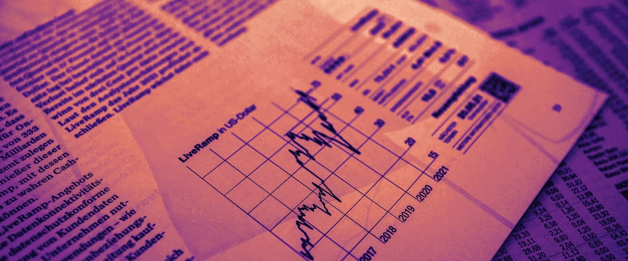 A printed stock price chart lying on the market tables of a newspaper
