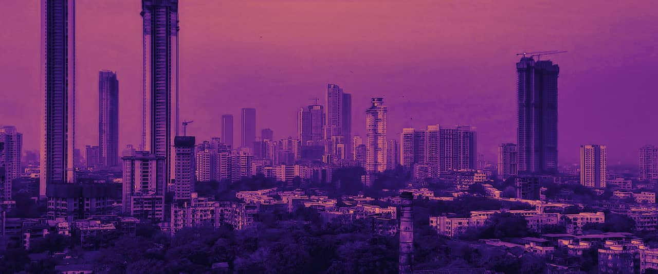 The Mumbai skyline of tall towers rising behind older low buildings