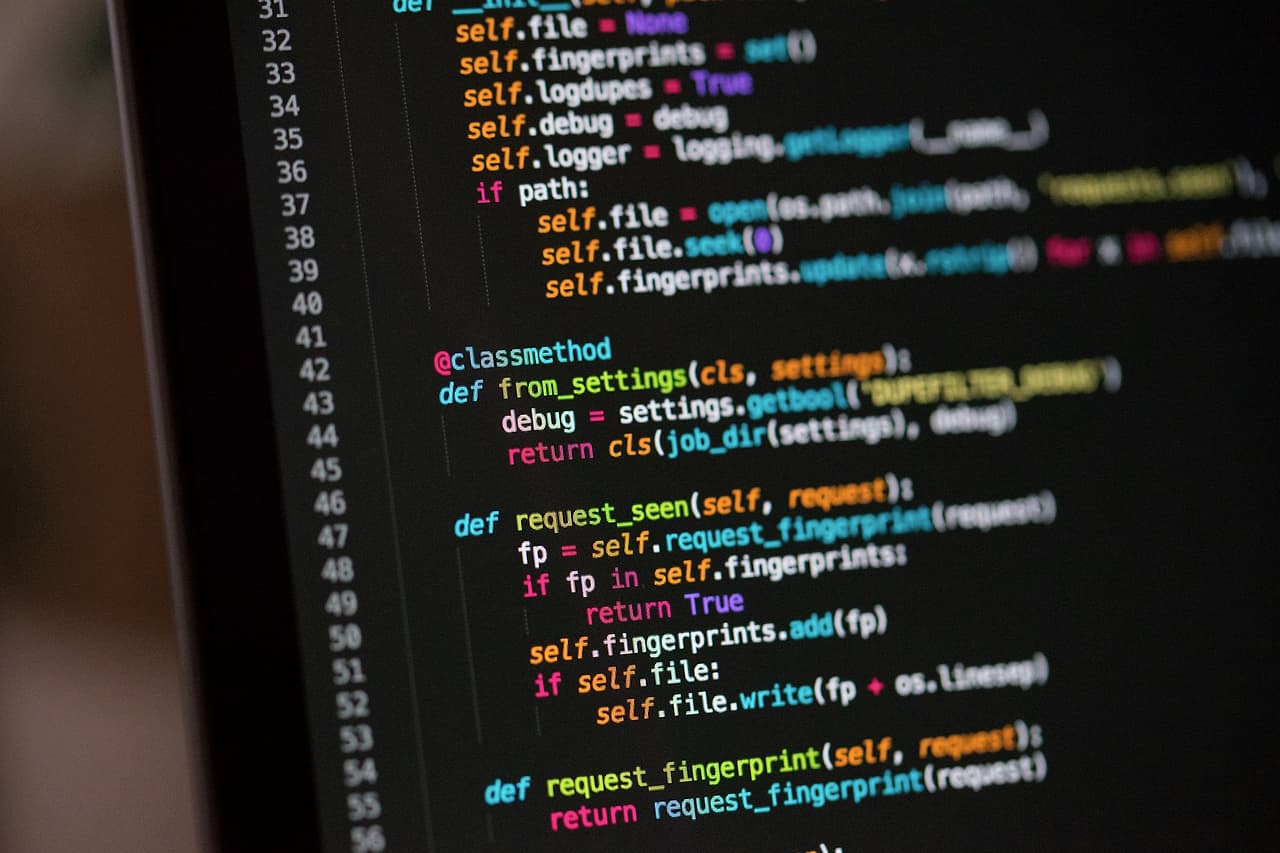 Lines of colour-highlighted source code on a dark screen