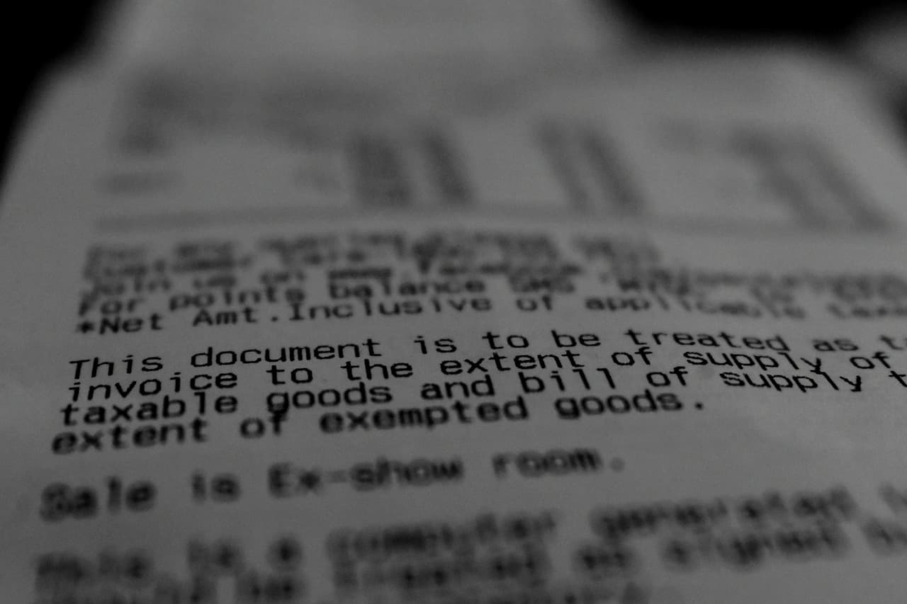 Close-up of dense printed text on a sheet of paper