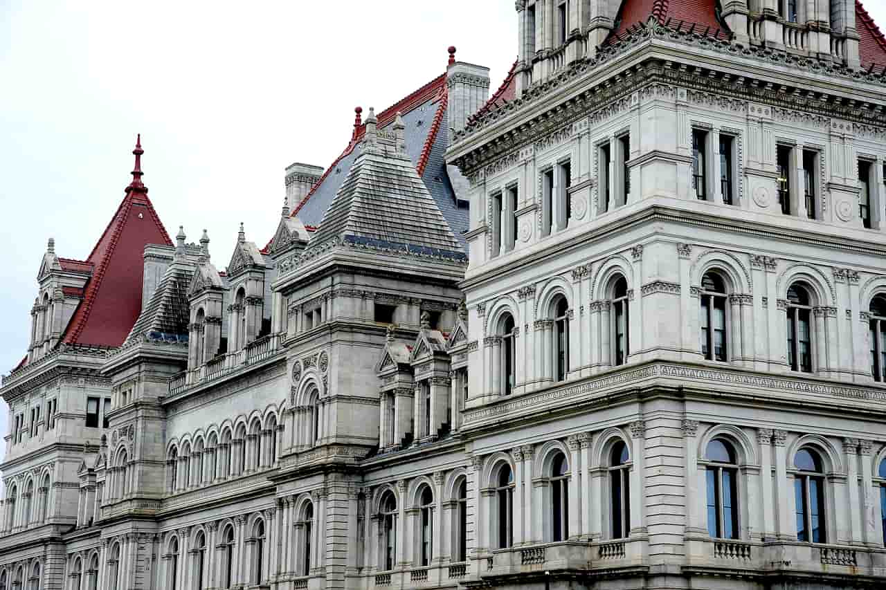 The ornate stone facade and red roofs of the New York State Capitol in Albany