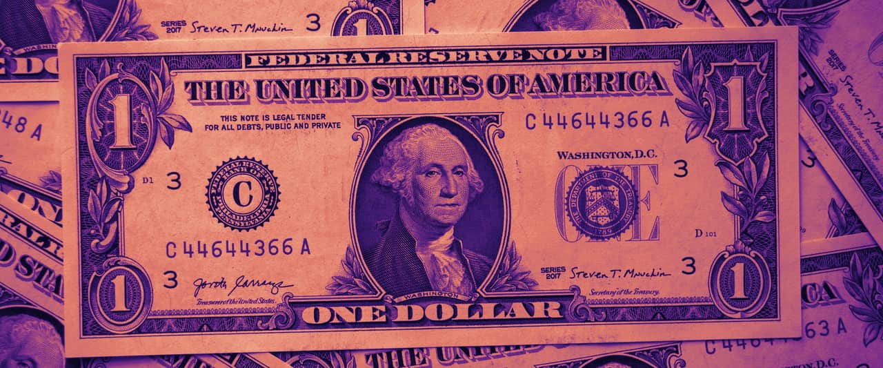 A pile of one dollar bills lying on top of each other