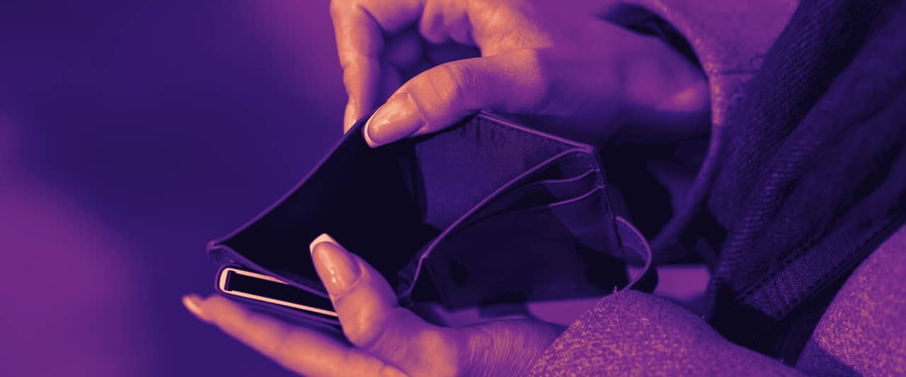 Two hands opening an empty brown leather wallet