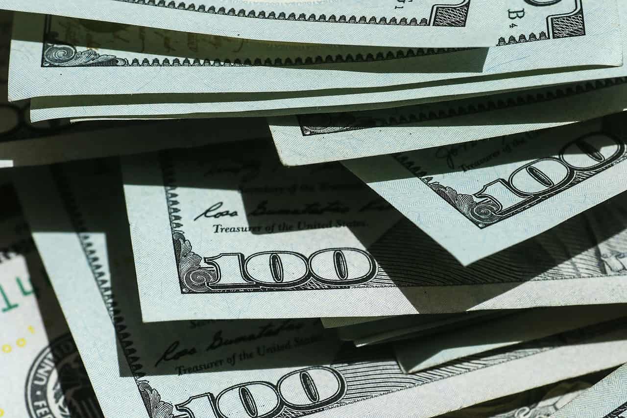 A close view of stacked hundred dollar bills